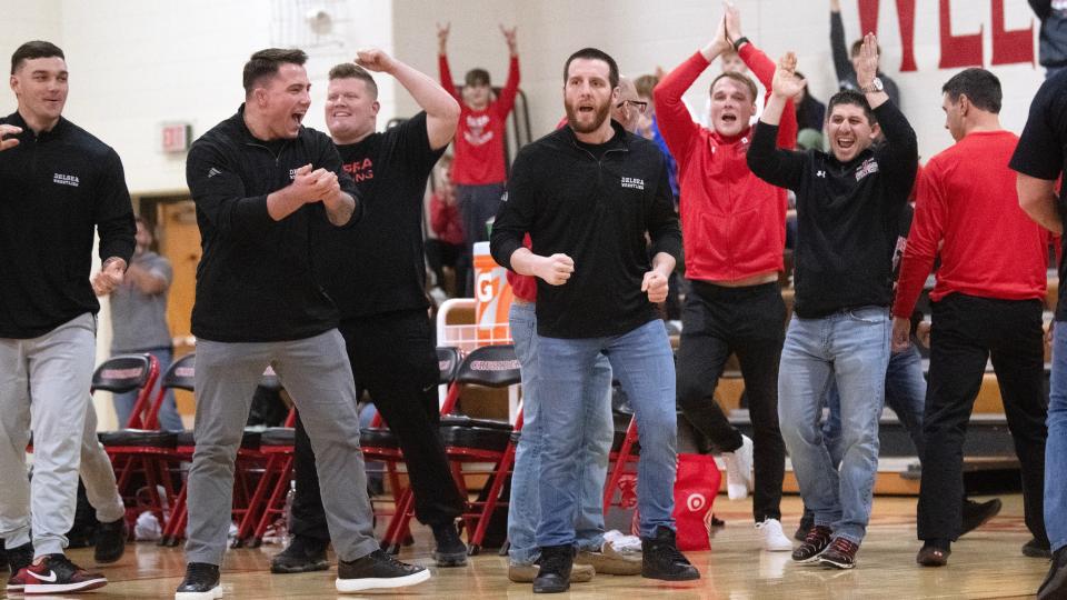 Members of the Delsea wrestling team react after Delsea's Greg Sawyer defeated Wayne Valley's Sean Van Dalinda, 5-3, during the 175 lb. bout of the state Group 3 wrestling semifinal held at Delsea Regional High School on Friday, February 9, 2024.