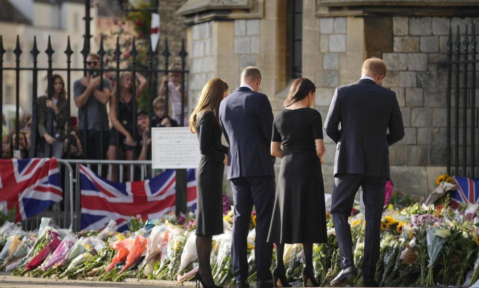 Royal family inspect floral tributes