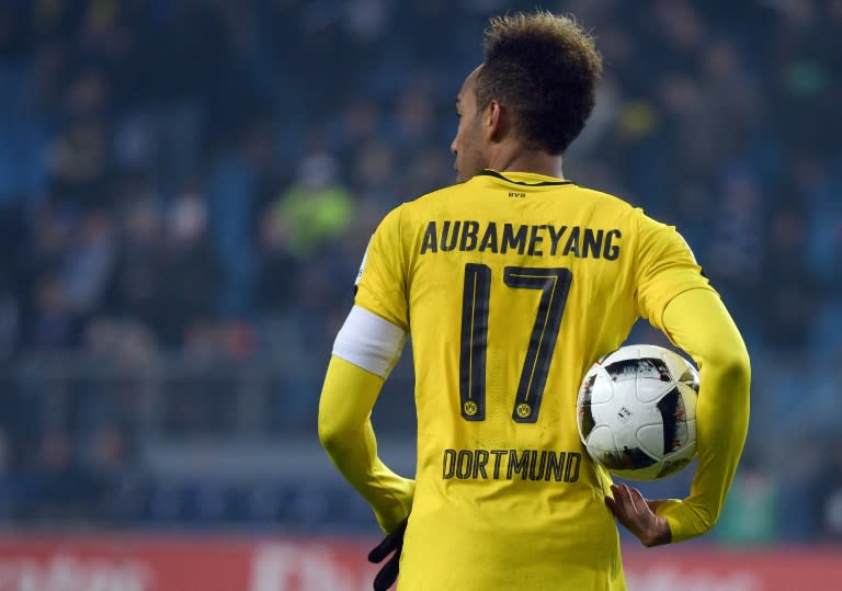 Dortmund's Pierre-Emerick Aubameyang holds the ball after scoring four times against bottom-ranked Hamburg SV on November 5, 2016