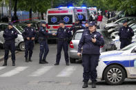 Police block streets around the Vladislav Ribnikar school in Belgrade, Serbia, Wednesday, May 3, 2023. A teenage boy opened fire early Wednesday in a school in central Belgrade, causing injuries. (AP Photo/Darko Vojinovic)