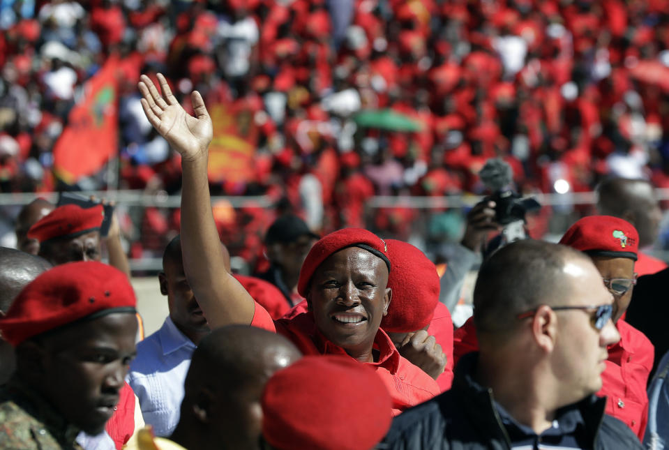 Leader of the Economic Freedom Fighters (EFF) party, Julius Malema, greets supporters as he arrives at Orlando Stadium in Soweto, South Africa, Sunday, May 5, 2019. Campaign rallies for South Africa’s upcoming election have reached a climax Sunday with mass rallies by the ruling party and one of its most potent challengers. (AP Photo/Themba Hadebe)