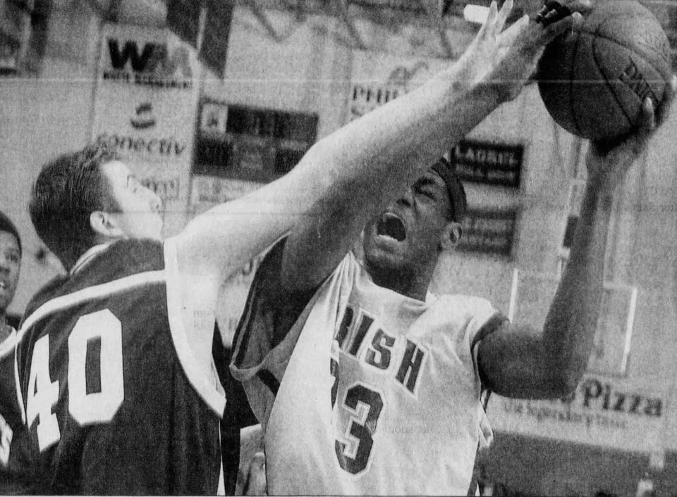 High school basketball player LeBron James is fouled at Slam Dunk to the Beach near Lewes on December 28, 2001.