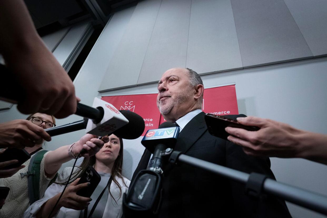 Quebec Health Minister Christian Dubé spoke to reporters outside Montreal's Palais de Congrès on Thursday. (Ivanoh Demers/Radio-Canada - image credit)