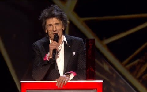 Ronnie Wood, doing his best to feign enthusiasm - Credit: ITV