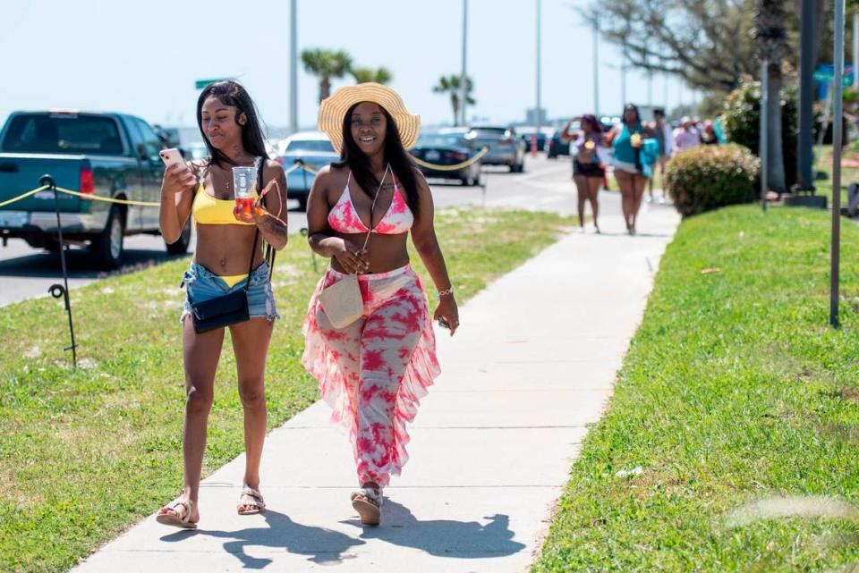 Spring breakers walk along Highway 90 during Black Spring Break in Biloxi on Saturday, April 13, 2024