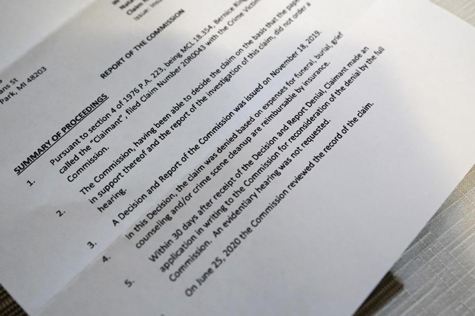 A photograph of Bernice Ringo’s denial for crime victim compensation from Michigan on March 28, 2023 in Detroit shows the state at first said she had insurance to cover his funeral costs. Her appeal was ultimately denied because the state said her son had somehow contributed to his own death. Natalian Ringo was fatally shot while sitting in his parked car in 2019. (AP Photo/Carlos Osorio)