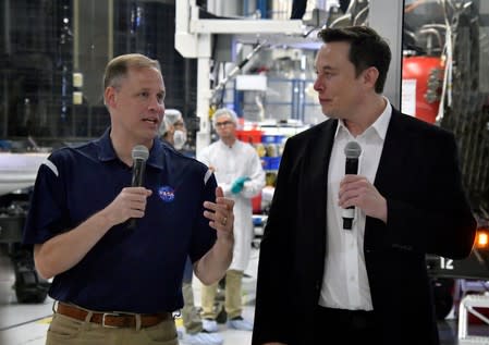 NASA Administrator Jim Bridenstine and SpaceX Chief Engineer Elon Musk talk to the press after a tour of SpaceX headquarters in Hawthorne