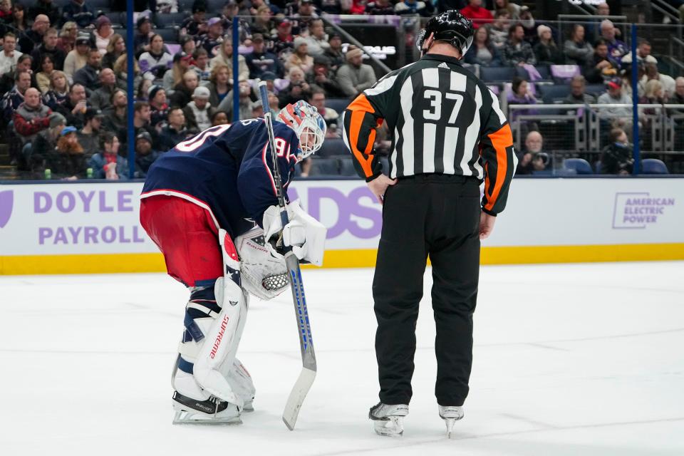 Columbus Blue Jackets goaltender Elvis Merzlikins leaves the game with an apparent injury during the second period of a game against the Philadelphia Flyers.