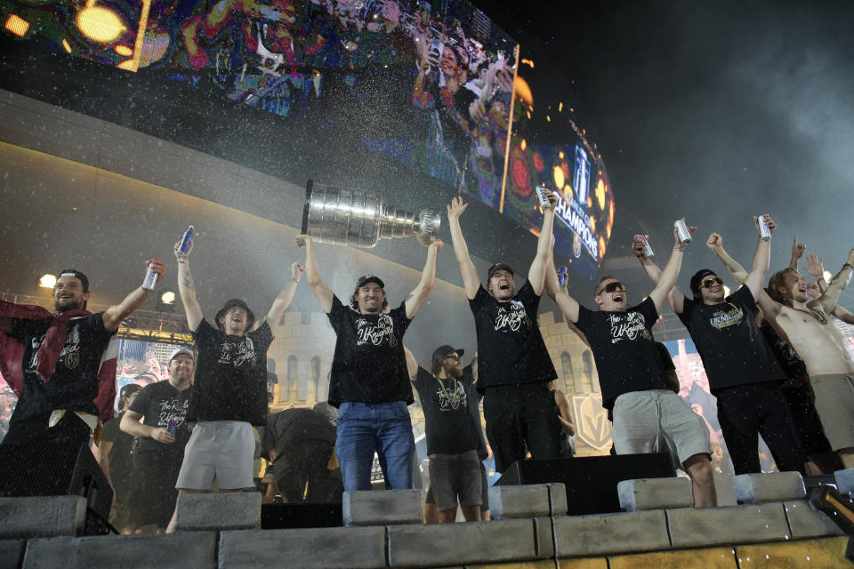 Vegas Golden Knights celebrate with the Stanley Cup during a rally after a parade along the Las Vegas Strip for the NHL hockey champions Saturday, June 17, 2023, in Las Vegas. (AP Photo/John Locher)