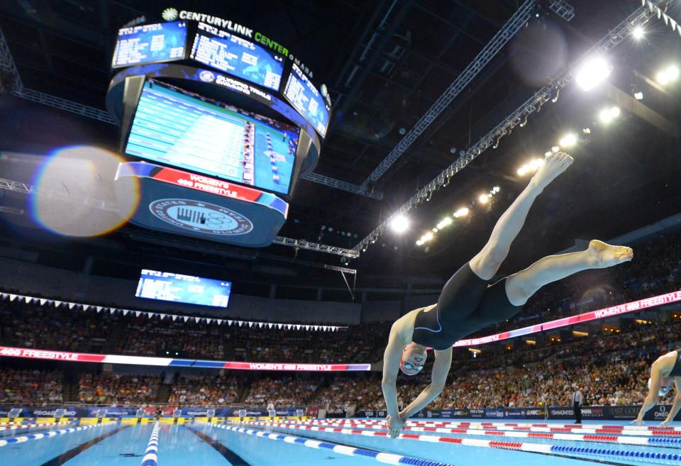 FILE - Katie Ledecky dives at the start of the women's 400-meter freestyle final at the U.S. Olympic swimming trials, June 27, 2016, in Omaha, Neb. Ledecky started off the U.S. national championships Tuesday, June 27, 2023, with a dazzling performance in the 800-meter freestyle. She turned in her fastest time since setting the world record at the 2016 Rio Olympics. At 26, Ledecky has already sealed her legacy as one of the greatest freestyle swimmers the sport has ever witnessed, yet she shows no signs of slowing down. (AP Photo/Mark J. Terrill, File)