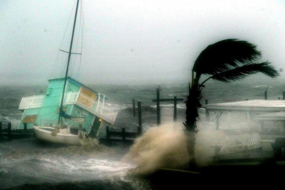 Hurricane Frances batters sailboat and a houseboat on a pier in Stuart (about noon on Sept. 5, 2004.)