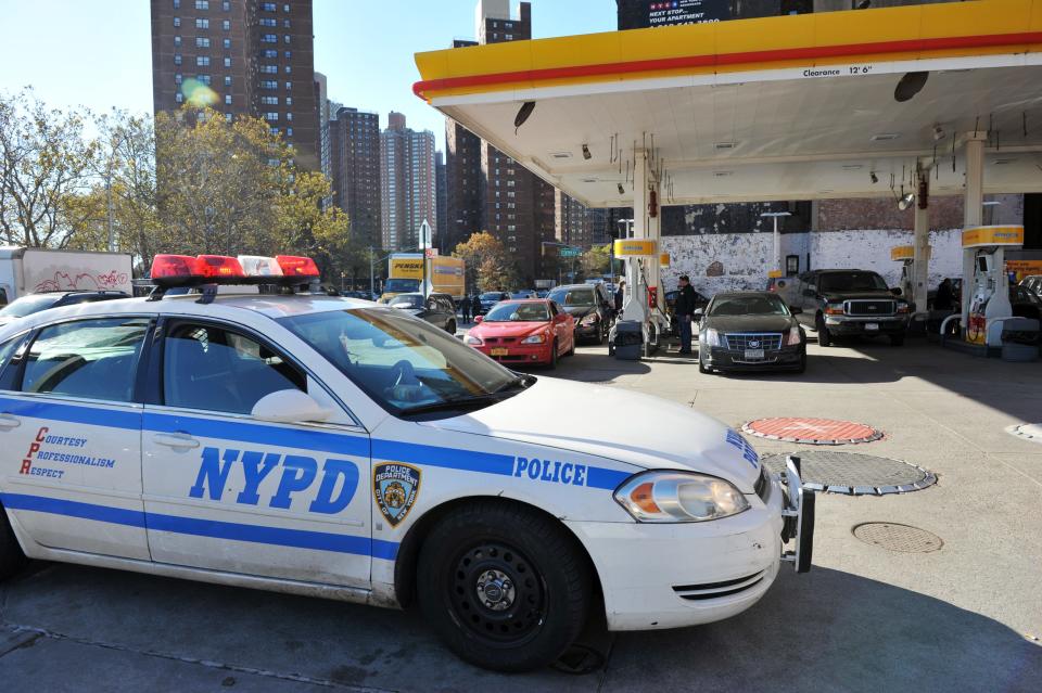 A New York Police Department car is pictured near a gas station near New York City