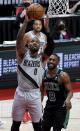 Portland Trail Blazers guard Damian Lillard drives to the basket past Boston Celtics guard Kemba Walker, right, during the second half of an NBA basketball game in Portland, Ore., Tuesday, April 13, 2021. (AP Photo/Steve Dykes)