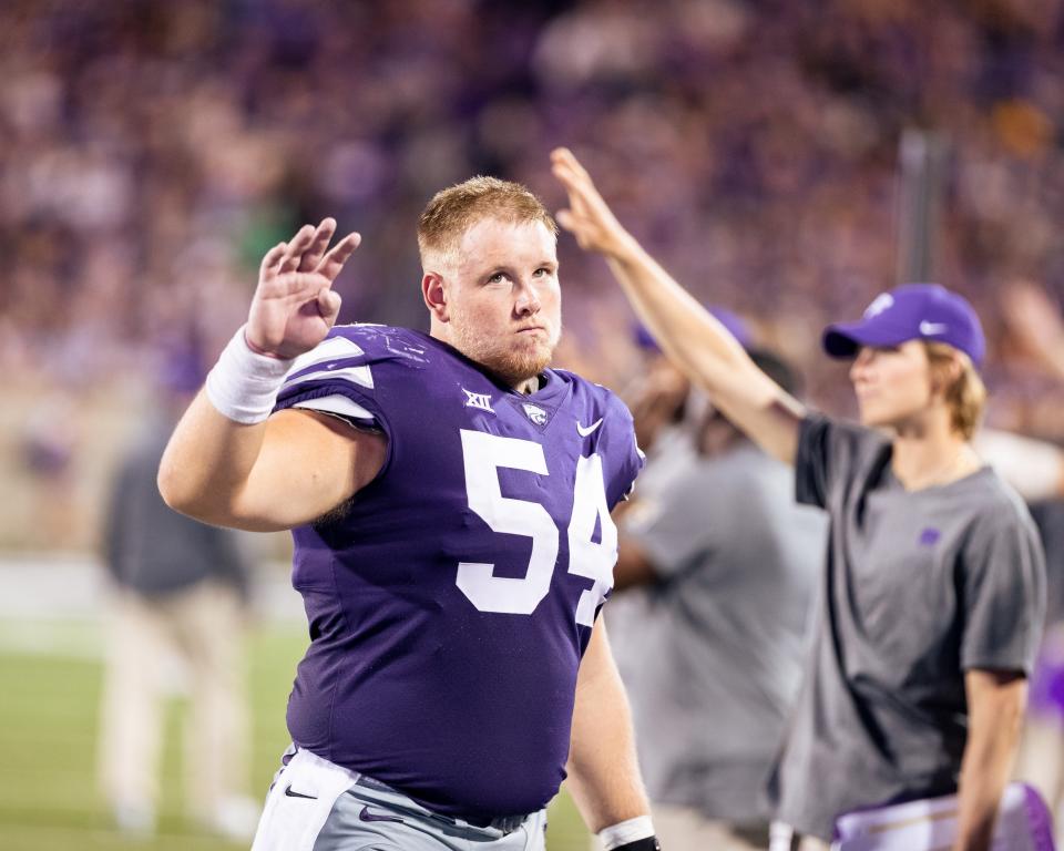 Kansas State junior offensive lineman Hadley Panzer (54) is battling senior Taylor Poitier for the starting right guard spot, according to an official depth chart released Monday.