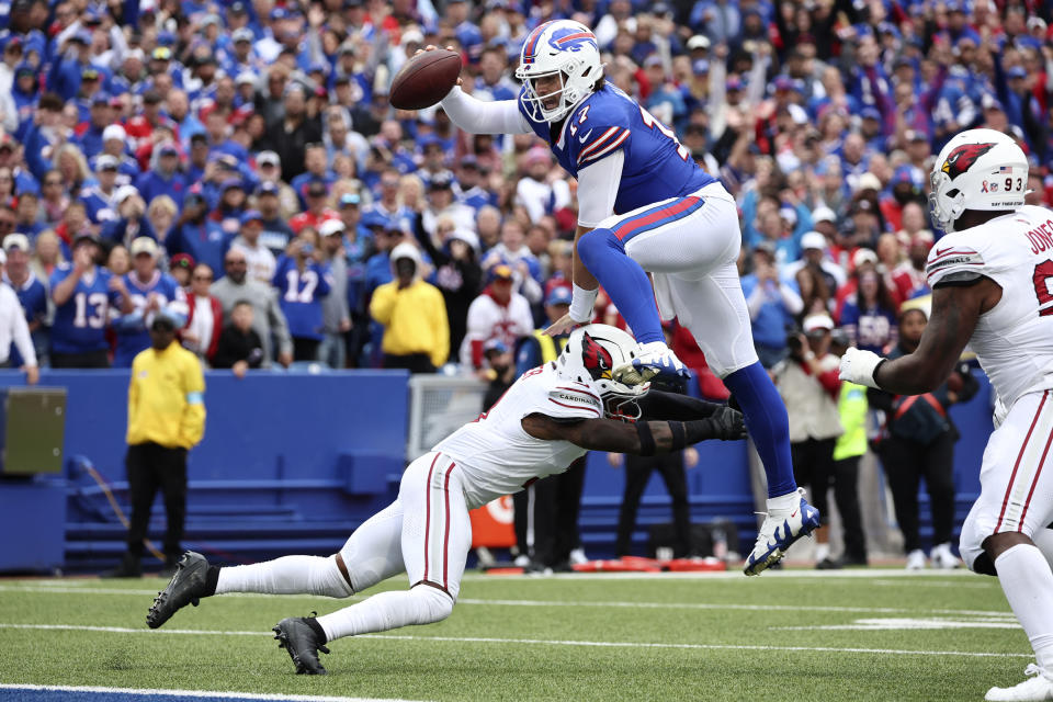 Buffalo Bills quarterback Josh Allen (17) leaps over Arizona Cardinals safety Budda Baker for a touchdown during the second half of an NFL football game Sunday, Sept. 8, 2024, in Orchard Park, N.Y. (AP Photo/Jeffrey T. Barnes)