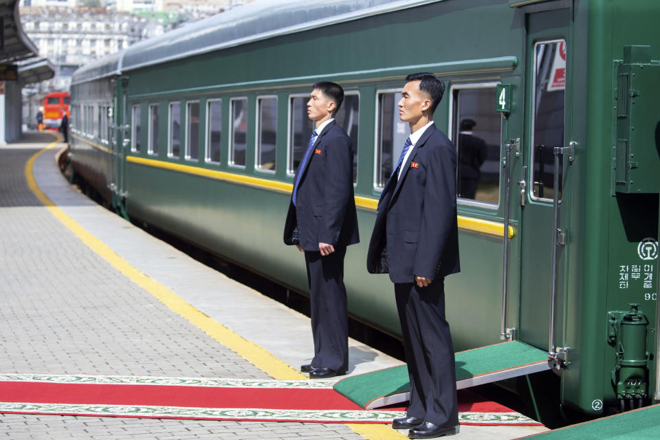 FILE - In this photo released by Press office of the administration of Primorsky Krai region, North Korea's security officers wait for North Korean leader Kim Jong Un near the train as he leaves Russia, at the main train station in Vladivostok, Russia, on April 26, 2019. North Korean leader Kim Jong Un’s possible trip to Russia might be like his first one in 2019, a rattling, 20-hour ride aboard a green-and-yellow armored train that is a quirky symbol of his family’s dynastic leadership. (Alexander Safronov/Press Office of the Primorye Territory Administration via AP, File)