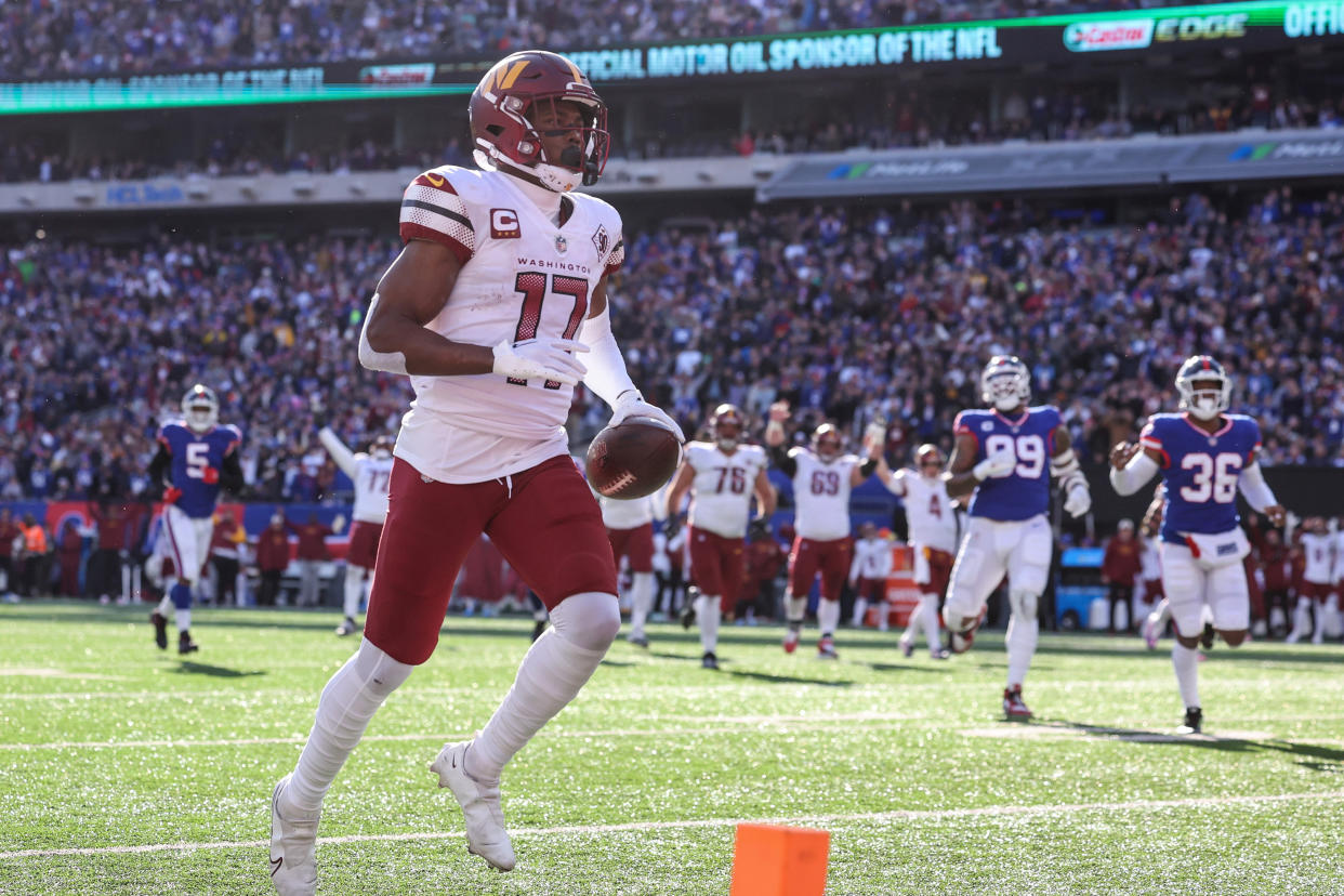 Dec 4, 2022; East Rutherford, New Jersey, USA; Washington Commanders wide receiver Terry McLaurin (17) score a receiving touchdown during the first half against the New York Giants at MetLife Stadium. Mandatory Credit: Vincent Carchietta-USA TODAY Sports