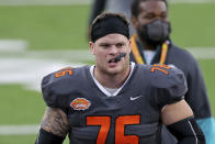 FILE - In this Jan. 30, 2021, file photo, National Team offensive lineman Spencer Brown, of Northern Iowa, walks off the field after the Senior Bowl NCAA college football in Mobile, Ala. The Buffalo Bills opened the 2021 draft by selecting edge rushers, Miami's Greg Rousseau and Wake Forest's Carlos Basham, with their first two picks, and then taking Northern Iowa offensive tackle Spencer Brown in the third round on Friday. (AP Photo/Rusty Costanza, File)