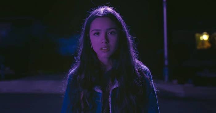 Olivia Rodrigo singing in the "drivers license" music video