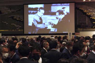 A monitor shows a photo of Chinese Premier Zhou Enlai, left, and Japanese Prime Minister Kakuei Tanaka toasting each other at a banquet in the Hall of the People in Beijing on Sept. 28, 1972, during a reception to mark the 50th anniversary of Japan-China diplomatic relations Thursday, Sept. 29, 2022, in Tokyo. (AP Photo/Eugene Hoshiko)