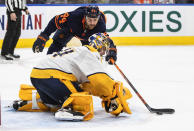 Nashville Predators goalie Juuse Saros (74) makes the save on Edmonton Oilers' Zack Kassian (44) during the second period of an NHL hockey game, Thursday, Jan. 27, 2022 in Edmonton, Alberta. (Jason Franson/The Canadian Press via AP)