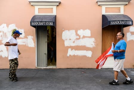 Demonstrators walk towards Fortaleza street during the fourth day of protest calling for the resignation of Governor Ricardo Rossello in San Juan