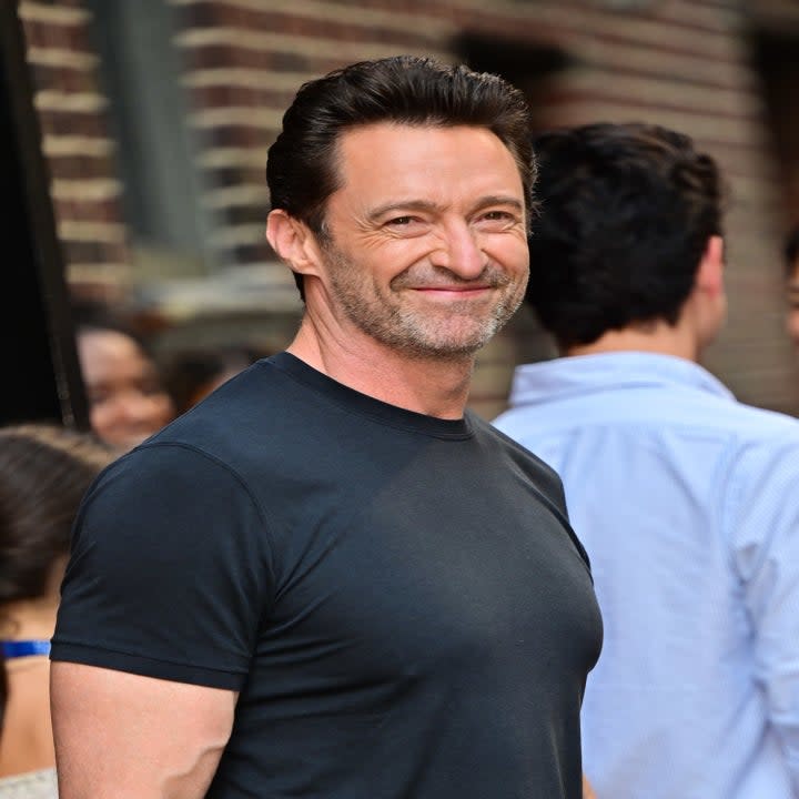 Hugh Jackman smiling outside