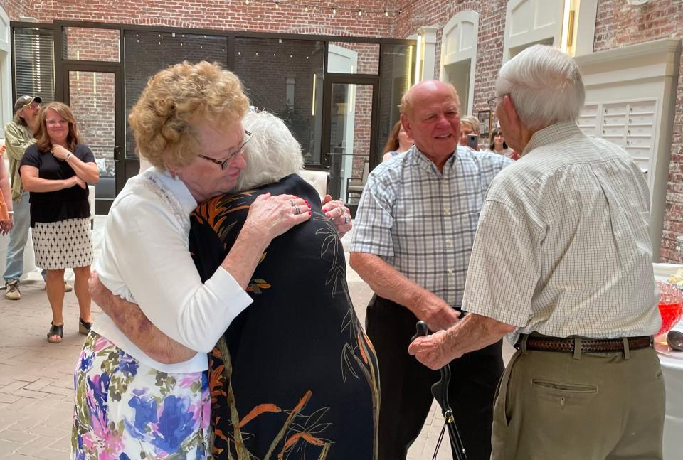 Old friends Janet and Dale Brummett greet Zenobia and David Booth at their 75th wedding anniversary celebration at Knoxville High Senior Living. The two couples struck up an instant friendship on a cruise in 1966 and have been close ever since. June 12, 2022.