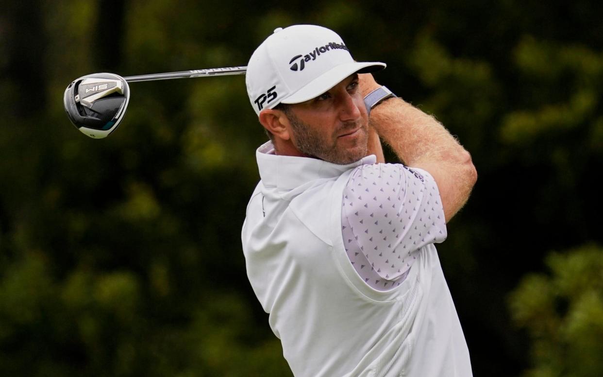 Dustin Johnson watches his tee shot on the 12th hole during the third round - AP Photo/Jeff Chiu