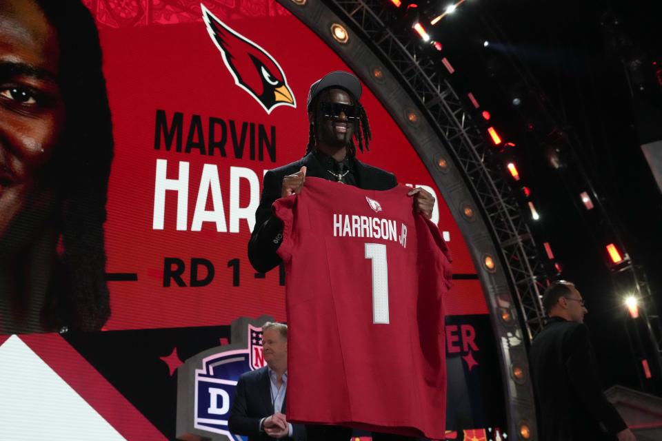 Apr 25, 2024; Detroit, MI, USA; Ohio State Buckeyes wide receiver Marvin Harrison Jr. poses after being selected by the Arizona Cardinals as the No. 4 pick in the first round of the 2024 NFL Draft at Campus Martius Park and Hart Plaza. Mandatory Credit: Kirby Lee-USA TODAY Sports