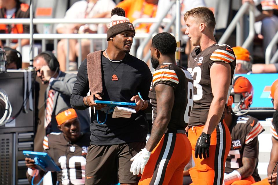 Browns QB Deshaun Watson, left, stands on the sideline during the first half against the Ravens, Sunday, Oct. 1, 2023, in Cleveland.