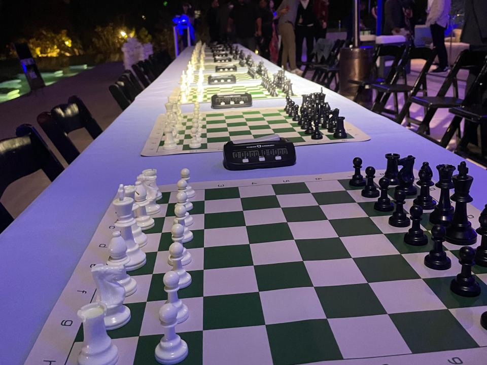 Ten chessboards were laid out on a table.