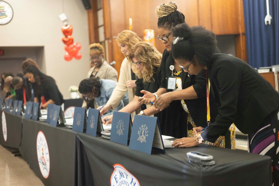 MSCS principals and Literacy Mid-South representatives can be seen signing certificates during the Memphis-Shelby County Schools and Literacy Mid-South Partnership Ceremony on Thursday, October 19, 2023 at the MSCS COE Auditorium in Memphis, Tenn.