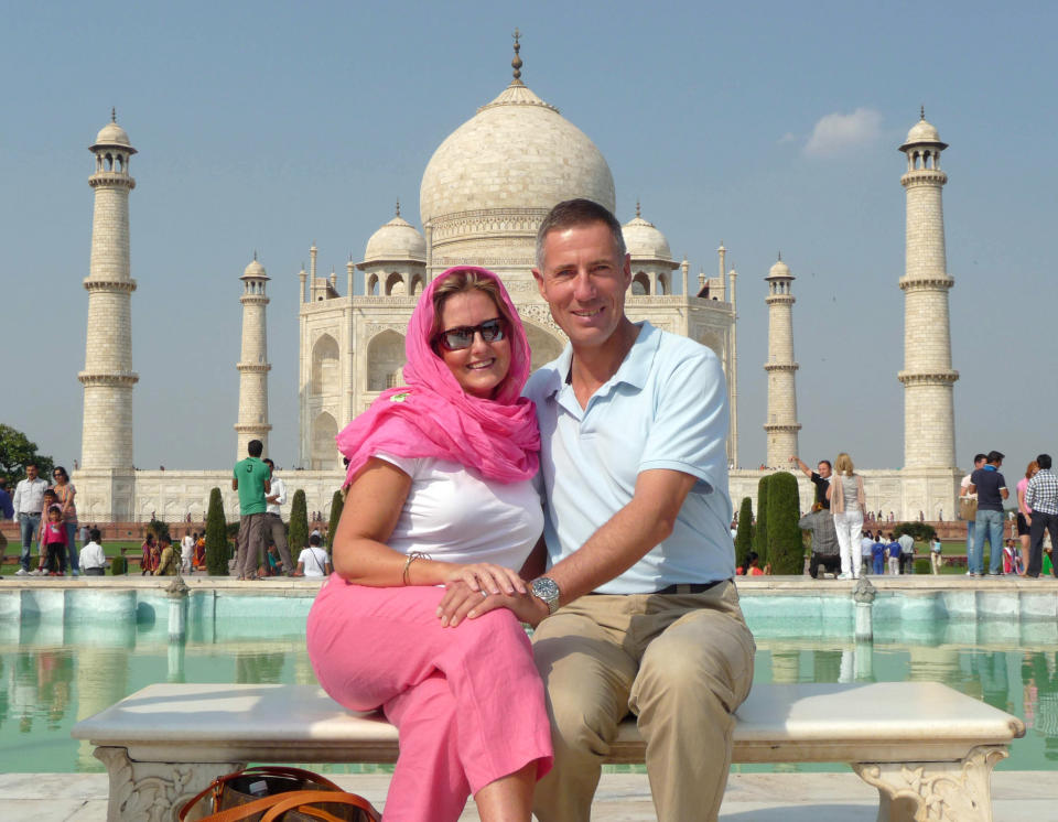 Britain's Andy Green, current record holder of the world land speed record and known to be the first person to break the sound barrier on land, poses with his wife Emma at the Taj Mahal in Agra on October 25, 2012.   (STRDEL/AFP/Getty Images)