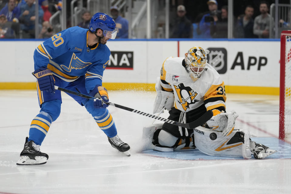 St. Louis Blues' Brandon Saad (20) is unable to score past Pittsburgh Penguins goaltender Tristan Jarry (35) during the second period of an NHL hockey game Saturday, Oct. 21, 2023, in St. Louis. (AP Photo/Jeff Roberson)