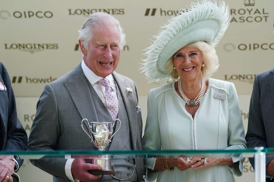 <p>David Davies/PA Images</p> King Charles III and Queen Camilla during a trophy presentation at the Royal Ascot.