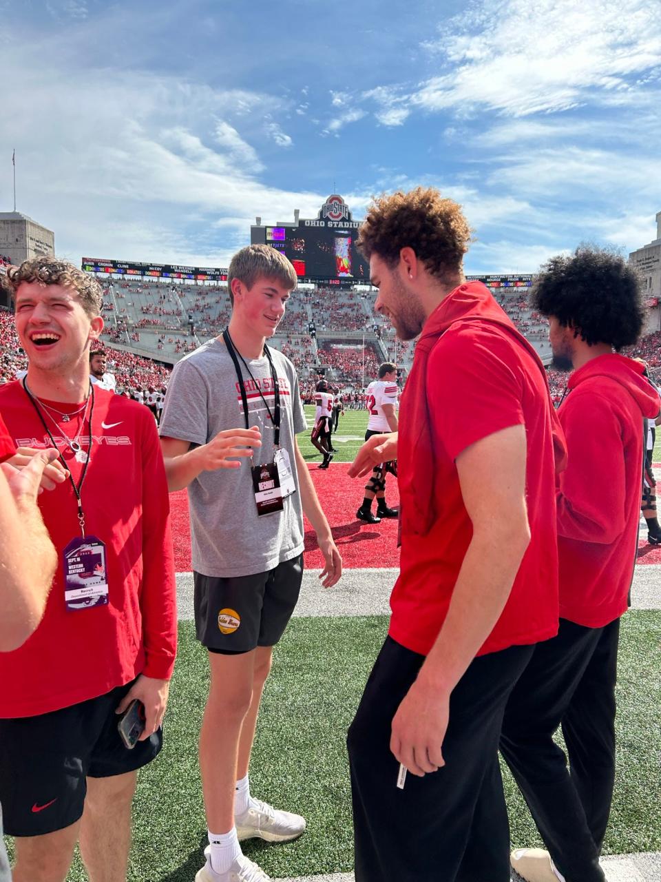 Upper Arlington's Alex Smith (left) shakes hands with Ohio State's Jamison Battle while on an unofficial visit to Ohio State on Sept. 16, 2023.