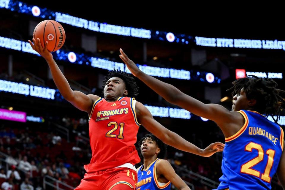 Karter Knox drives around Jayden Quaintance during the second half of Tuesday night’s McDonald’s All-American Game in Houston. Both players will be freshmen at the University of Kentucky next season.