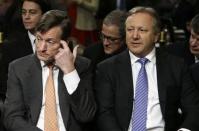 Credit Suisse CEO Brady Dougan (L) and Credit Suisse official Hans Urlich-Meister (R) await to testify before the Senate Homeland and Governmental Affairs Investigations Subcommittee on Capitol Hill in Washington February 26, 2014. REUTERS/Gary Cameron