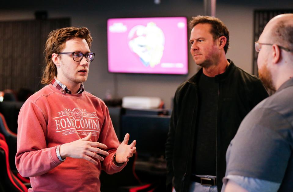 Zone 3 Springfield City Councilman Brandon Jenson talks with Contender eSports Owner Brett Payne (center) and Mike Chapman, director of operations, about a proposed ordinance that would ban the operation of any entertainment device that offers a monetary prize on Saturday, Feb. 10, 2024.
