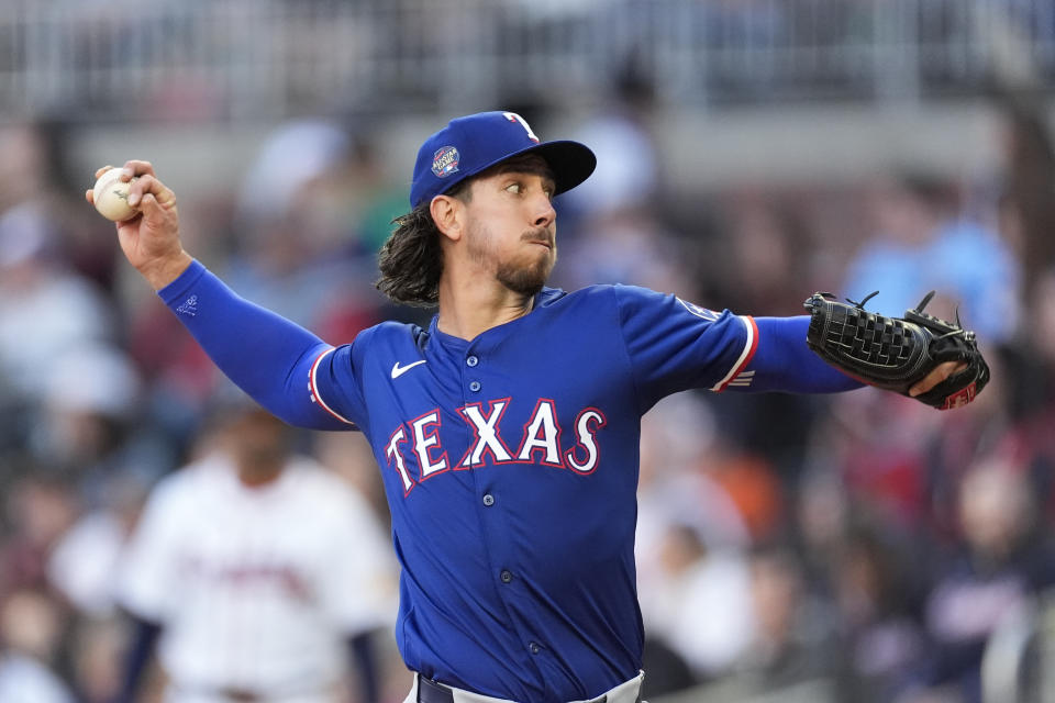 Texas Rangers pitcher Michael Lorenzen delivers to a Atlanta Braves batter in the first inning of a baseball game Sunday, April 21, 2024, in Atlanta. (AP Photo/John Bazemore)