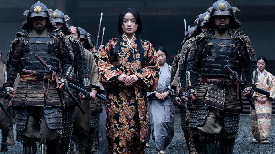 Anna Sawai being escorted by armored guards in Shōgun.