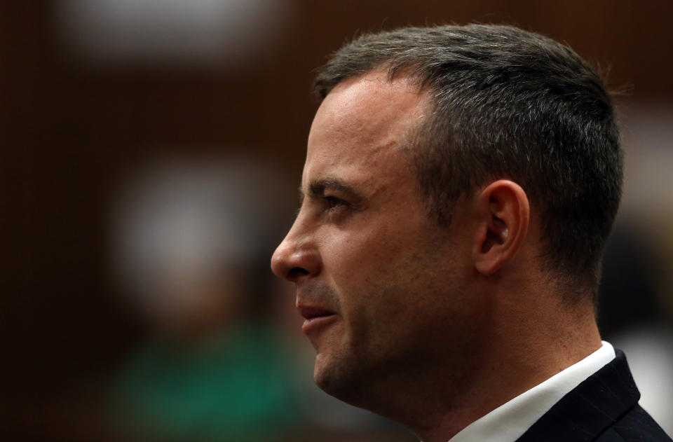 Oscar Pistorius stares ahead as he yawns in court while listening to forensic evidence in Pretoria, South Africa, Thursday, April 17, 2014. Pistorius is charged with the murder of his girlfriend, Reeva Steenkamp, on Valentines Day in 2013. (AP Photo/Themba Hadebe, Pool)
