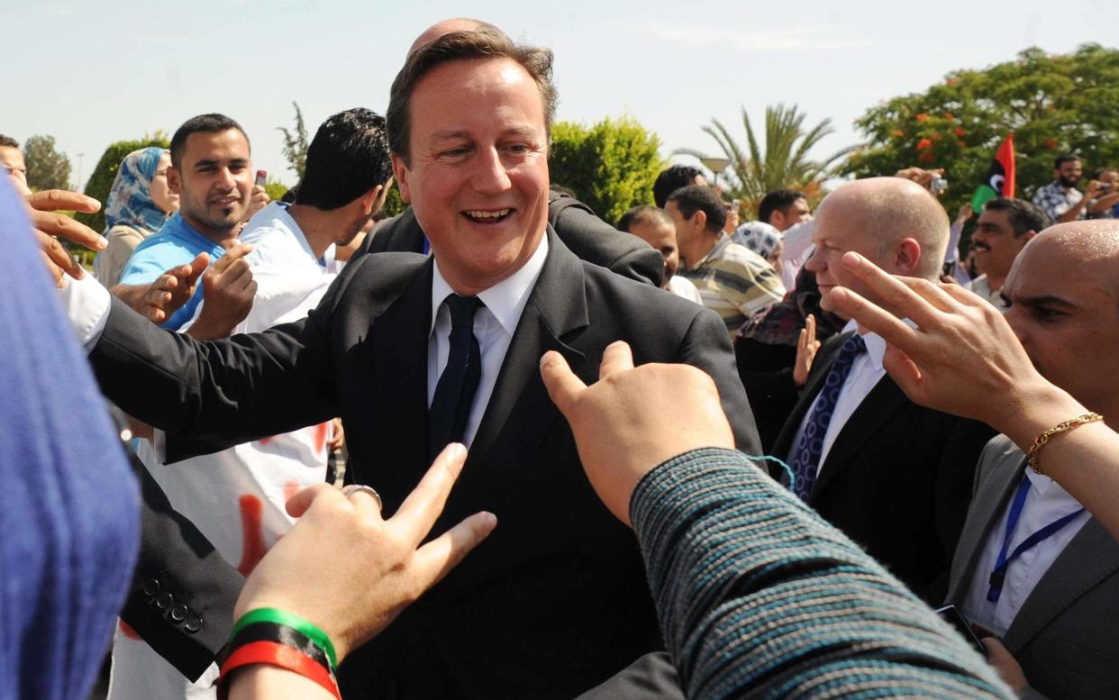 David Cameron meet patients and staff at the Tripoli Medical Centre in Tripoli in 2011 - PA