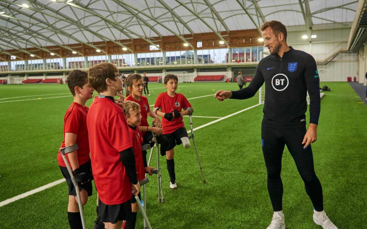 Footballer Harry Kane with children from the England Amputee Football Association - WARNING: Use of this copyright image is subject to the terms of use of BBC Pictures' Digital Picture