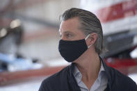 California Gov. Gavin Newsom visits the California Department of Forestry and Fire Protection's McClellan Reload Base in Sacramento, Calif., Thursday, July 9, 2020, to discuss the state's new efforts to protect emergency personnel and evacuees from COVID-19 during wildfires. (AP Photo/Hector Amezcua, Pool)