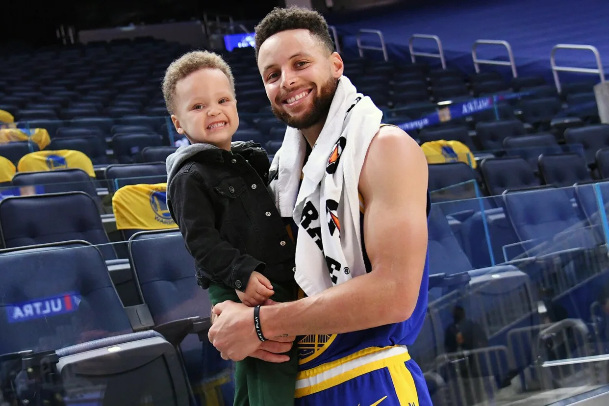 SAN FRANCISCO, CA - MARCH 14: Stephen Curry #30 of the Golden State Warriors poses with his son Canon after the game against the Utah Jazz on March 14, 2021 at Chase Center in San Francisco, California. NOTE TO USER: User expressly acknowledges and agrees that, by downloading and or using this photograph, user is consenting to the terms and conditions of Getty Images License Agreement. Mandatory Copyright Notice: Copyright 2021 NBAE (Photo by Noah Graham/NBAE via Getty Images)