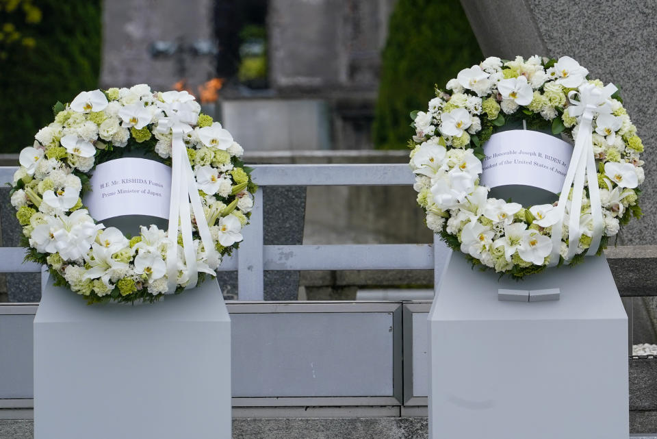 The wreath's of Prime Minister Fumio Kishida, left, of Japan and U.S. President Joe Biden are pictured following a wreath laying ceremony at the Hiroshima Peace Memorial Park in Hiroshima, Japan, Friday, May 19, 2023, during the G7 Summit. (AP Photo/Susan Walsh,Pool)