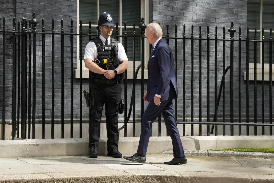 US President Joe Biden looks at a police officer as he arrives to meet with Britain's Prime Minister Rishi Sunak at 10 Downing Street in London, Monday, July 10, 2023. (AP Photo/Frank Augstein)