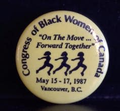 A button from Congress of Black Women of Canada showing silhouettes of Black women in a row